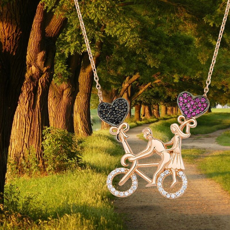 Taki | Couple Riding a Bike Silver Necklace with Heart - TryAladdin